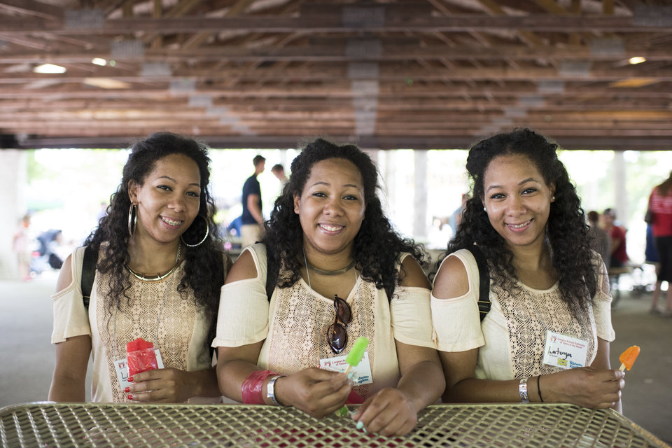 Identical triplets Latrina, Latasha and Latoya Thompson, 25 from Detroit Michigan, attend the Twins Days Festival for the first time. Photo by Dustin Franz